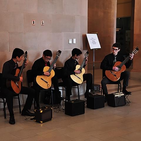 Student Guitar Quartet performs before a Saturday Morning series performance.